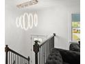 Staircase with railing and modern chandelier at 2120 Pair Sw Rd, Marietta, GA 30008
