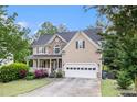 Beautiful two-story home boasting a covered porch, manicured lawn, and an attached two-car garage at 2164 Caneridge Sw Dr, Marietta, GA 30064