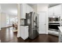 Well-equipped kitchen features stainless steel refrigerator and built-in microwave at 3051 Mountain Shadow Way, Marietta, GA 30064