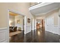 Spacious foyer featuring hardwood floors, detailed trim, and an open view to the living spaces at 1153 Brookhaven Commons Ne Dr, Brookhaven, GA 30319
