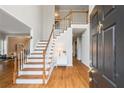 Grand foyer with hardwood floors, a staircase, and a view of the second story at 1988 Claiborne Ct, Marietta, GA 30062