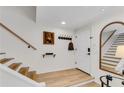 Bright entryway with hardwood floors, staircase, and modern accents at 2495 Northlake Ne Ct, Atlanta, GA 30345