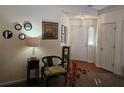 Inviting home foyer featuring a decorative rug, chair, and a view of the front door and sidelight at 4409 Deborahs Ct # 0, Union City, GA 30291