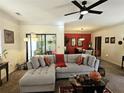 Comfortable living room with a plush sofa, a ceiling fan, and a view into the adjacent dining area at 4409 Deborahs Ct # 0, Union City, GA 30291