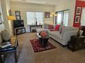 Comfortable living room featuring a large sectional sofa, media center, and bright natural light at 4409 Deborahs Ct # 0, Union City, GA 30291