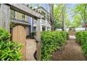 Inviting backyard featuring a private patio and lush landscaping at 719 Hammond Dr, Woodstock, GA 30188