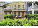 Beautiful townhome with a well-maintained patio and manicured greenery at 719 Hammond Dr, Woodstock, GA 30188