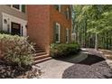 Brick and siding home with steps leading to the front door and a landscaped walkway at 1819 Walker Ridge Sw Dr, Marietta, GA 30064