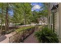Brick walkway and iron railing lead to the house entrance with a fern in a pot at 1819 Walker Ridge Sw Dr, Marietta, GA 30064
