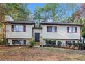 A beautiful two-story home featuring a well-maintained lawn and classic architectural details at 4391 Sandy Plains Rd, Marietta, GA 30066