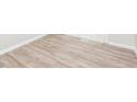 An angled view showcases the stylish, wood-look flooring in the room at 4391 Sandy Plains Rd, Marietta, GA 30066
