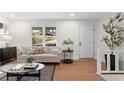Comfortable living room with ample natural light, neutral color scheme, and cozy seating area at 7000 Woodland Nw Pl, Kennesaw, GA 30152