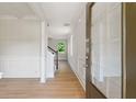 Bright entryway with hardwood floors and decorative wainscoting at 3625 New River Ct, Cumming, GA 30040