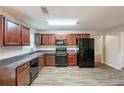 Well-designed kitchen with wooden cabinets, sleek appliances, and durable countertops at 4205 Post Oak Grv, Atlanta, GA 30349