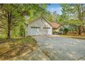 This home includes an attached two-car garage and a large driveway at 6095 Wayfarer Dr, Villa Rica, GA 30180