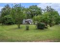 Serene property with mature trees surrounding a lovely two-story home at 127 Stagecoach Trl, Stockbridge, GA 30281