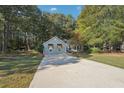 Well-kept single story home, large front yard and a concrete driveway at 45 Park Place Dr, Covington, GA 30016