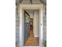 An open front door view of a home with hardwood floors and a decorative wreath at 491 Princeton Ne Way, Atlanta, GA 30307