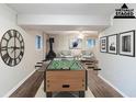 Finished basement offering a fireplace, foosball table, and comfortable sitting area at 5802 Oakleaf Dr, Stone Mountain, GA 30087