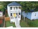 Inviting two-story home showcasing double front porches and a well-maintained yard in a desirable location at 955 Coleman Sw St, Atlanta, GA 30310