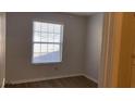 Bright bedroom with new blinds, and a neutral color palette, ready for personal touches at 1304 Old Coach Sw Rd, Marietta, GA 30008