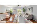 Open loft area with hardwood floors, gray walls, and a ceiling fan at 833 Charles Bank Se Ave, Atlanta, GA 30312