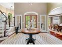 Welcoming home foyer featuring a decorative table and an eye-catching zebra-print rug at 560 Indigo Dr, Roswell, GA 30075
