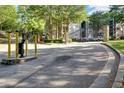 Gated entrance to a community with mature trees and a secure entry at 8106 Santa Fe Pkwy, Atlanta, GA 30350