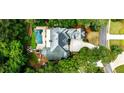 Aerial view of home showcasing the large in-ground pool and verdant landscaping at 1114 Waterford Green Pt, Marietta, GA 30068