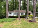 A charming home nestled among mature trees and verdant landscaping at 1962 Clairmont Ter, Atlanta, GA 30345