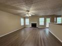 Cozy living room with fireplace and a door to the deck at 1822 Millwood Park Ct, Buford, GA 30518