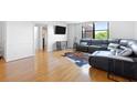 Bright living space boasting hardwood floors, a modern media cabinet, and comfortable sectional sofa at 2965 Pharr Court South Nw # 1-817, Atlanta, GA 30305
