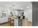 Well-lit kitchen featuring modern appliances, bar seating, and an adjacent door for easy outdoor access at 3331 Doyle Sw Ln, Marietta, GA 30060
