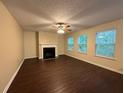 Spacious living room featuring a fireplace and laminate flooring at 110 Slate Ridge Ln, Loganville, GA 30052