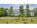 A daytime exterior view of an apartment building with mature trees and landscaping at 821 Ralph Mcgill Ne Blvd # 3325, Atlanta, GA 30306