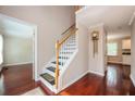 Welcoming entryway features hardwood floors, a staircase, and access to multiple rooms at 2980 Milford Sw Trl, Marietta, GA 30008