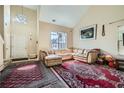 Bright living room featuring high ceilings, chandelier, large windows, and comfortable seating at 3812 Maclaren Dr, Clarkston, GA 30021