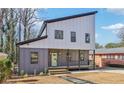 Charming home featuring a modern design, gray siding, and inviting front porch at 665 Ferris St, Atlanta, GA 30310