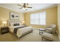 Cozy bedroom with neutral tones, a comfortable bed, and natural light from the window at 10462 Bent Tree Vw, Duluth, GA 30097