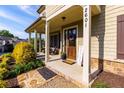 Inviting front porch with stone walkway and cozy seating area at 2601 Boulder Way, Woodstock, GA 30188