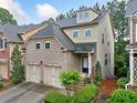 Beautifully landscaped home featuring a brick front and inviting entrance at 548 Myrtle Trace Ln, Suwanee, GA 30024