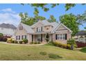 Beautiful brick home with lush landscaping and inviting front porch area at 2920 Stanway Ave, Douglasville, GA 30135
