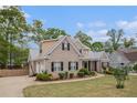 Beautiful brick home showcasing manicured landscaping and a curved walkway at 2920 Stanway Ave, Douglasville, GA 30135