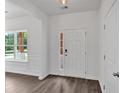 Bright entryway with wood-look floors and a window providing natural light at 4140 Chapel Hill Reserve, Douglasville, GA 30135