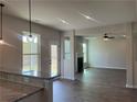 Open-concept living room featuring a fireplace, recessed lighting, and large windows at 4140 Chapel Hill Reserve, Douglasville, GA 30135