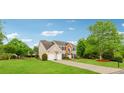 Side view of a well maintained home with lush landscaping, and a basketball hoop at 7545 Brookwood Way, Cumming, GA 30041