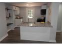 Modern kitchen with granite countertops, stainless steel sink, and a convenient island at 2040 Penelope Nw St, Atlanta, GA 30314