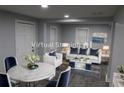 Stylish living and dining area with modern decor, comfortable seating, and ample natural light for a welcoming atmosphere at 2040 Penelope Nw St, Atlanta, GA 30314