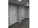 Versatile room featuring neutral gray walls and flooring, a closet, and window that offers natural light at 2040 Penelope Nw St, Atlanta, GA 30314