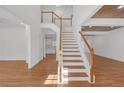 Bright foyer features wood staircase and wood-look ceiling at 552 Steels Bridge Rd, Canton, GA 30114